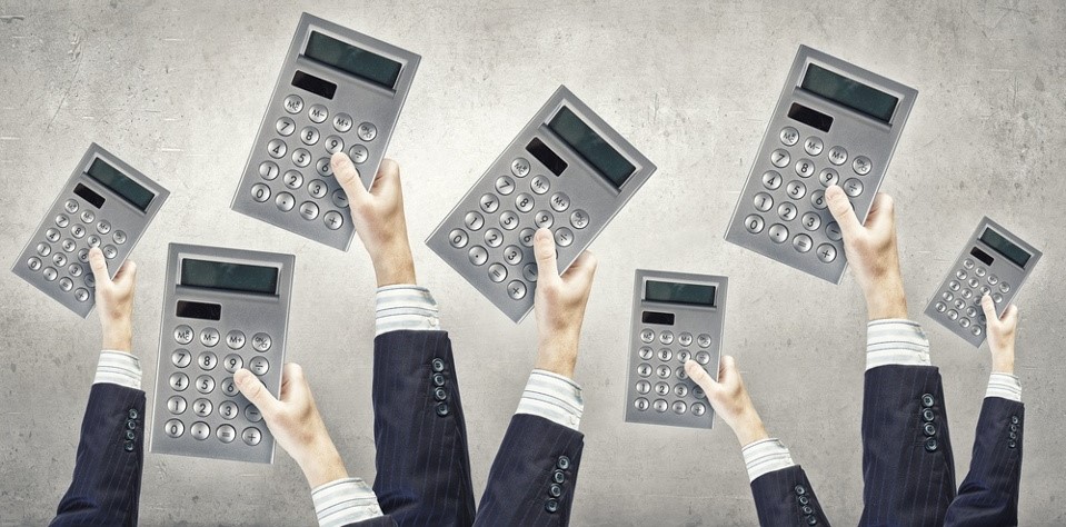 hands holding calculators